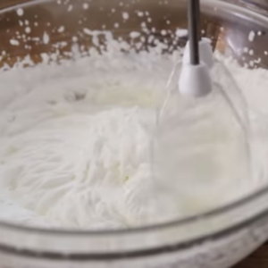The image shows the process of Preparing whipped cream for dulce de leche cake