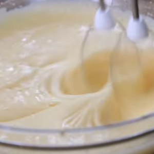 The image shows the process of preparing dulce de leche cake cake batter
