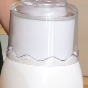 The image shows the blended mixture of oat milk ice cream in ice cream maker