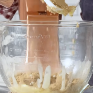 This image shows the process of adding sugar to the container for edible cookie dough recipe
