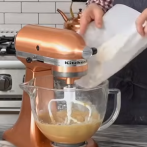 this image shows the process of adding flour to the mixture of edible cookie dough