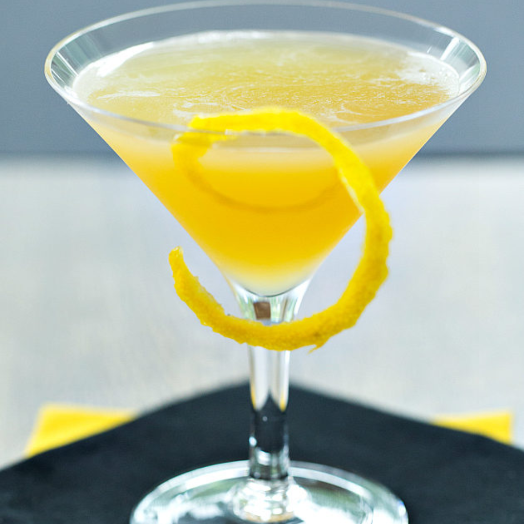 The image shows honey bee cocktail serve in a glass  